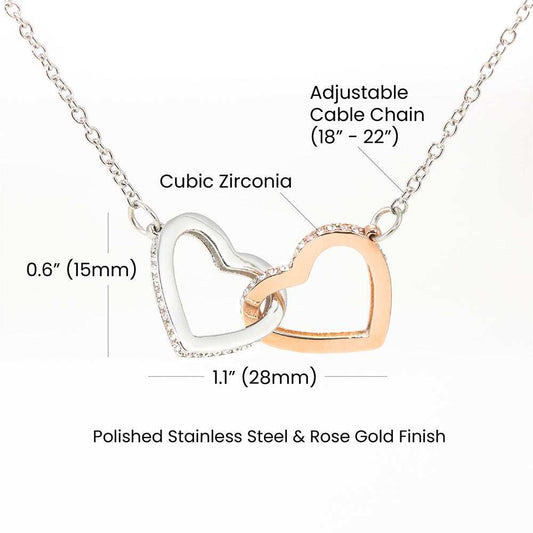 Two interlocking hearts necklace with cubic zirconia crystals, symbolizing unbreakable bond, in rose gold and surgical steel finish.