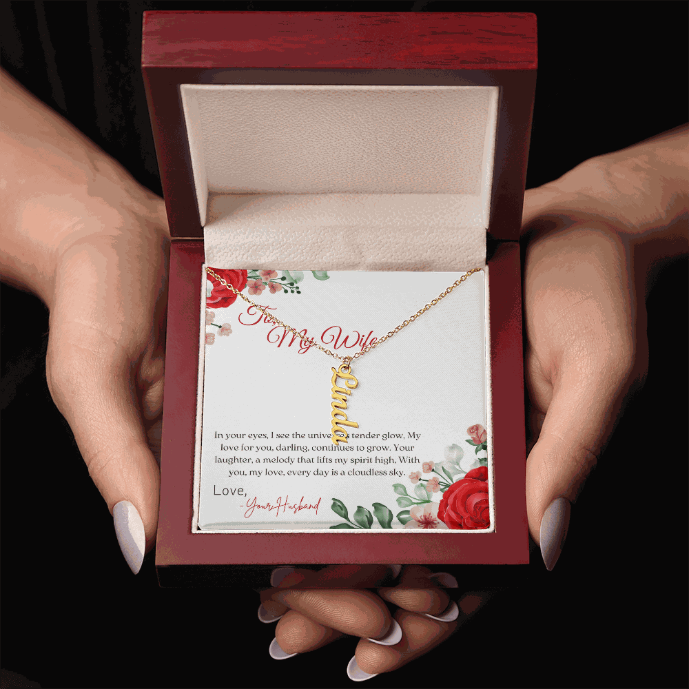Personalized vertical name necklace in polished stainless steel with adjustable cable chain on white background