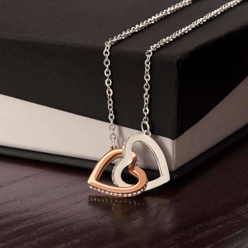 Unbreakable Bond Necklace with two interlocking CZ crystal hearts on rose gold chain